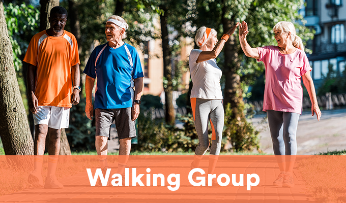 Image of seniors in active wear outdoors walking as a group